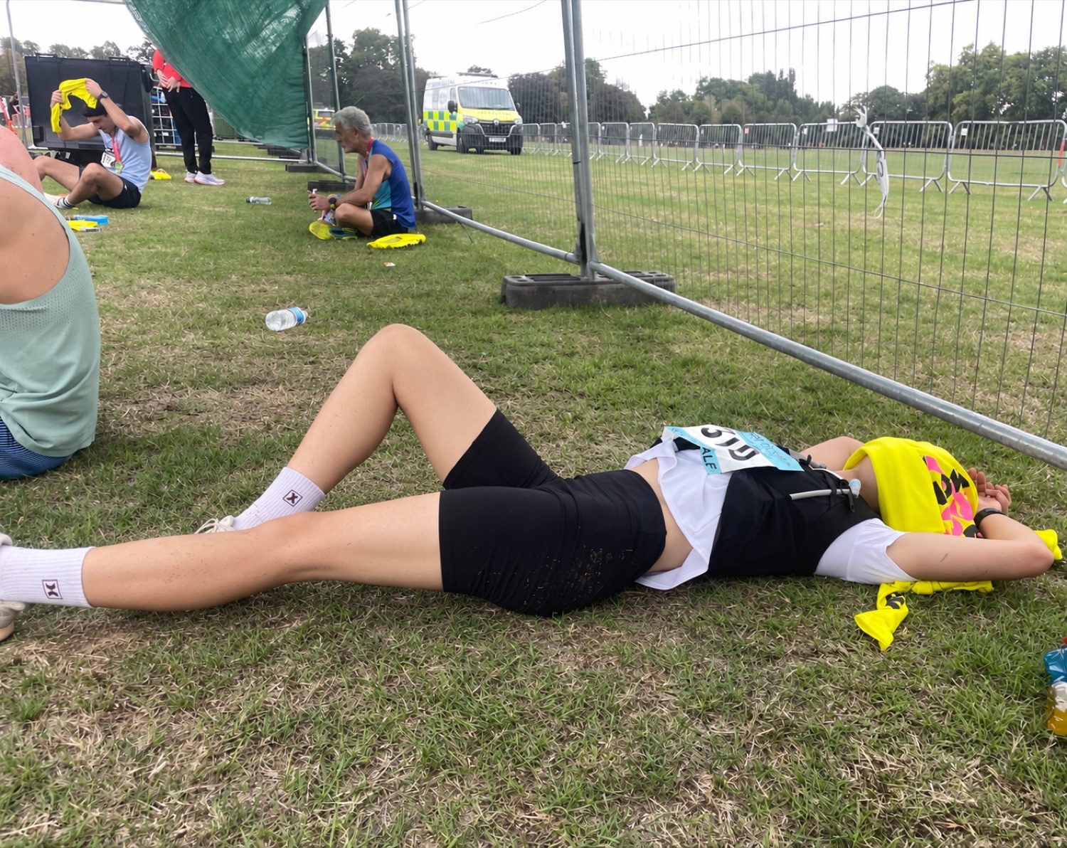 Lying on the grass after the finish